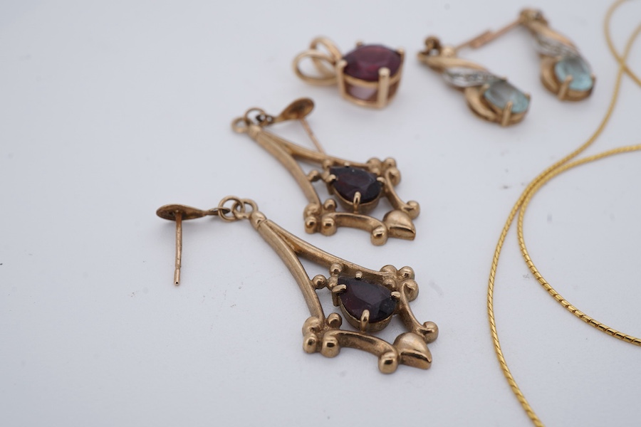 A group of jewels, comprising: a pair of garnet drop earrings; and a broken gold chain, each in 9ct gold, both with British hallmarks; a garnet pendant; and a pair of blue topaz and diamond earrings, each mounted in gold